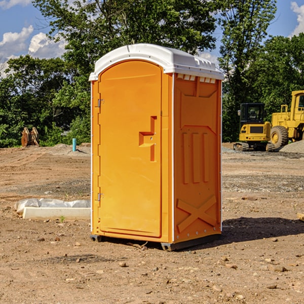 what is the cost difference between standard and deluxe portable restroom rentals in Leona